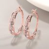boucles d'oreilles petits anneaux sertis de strass rose